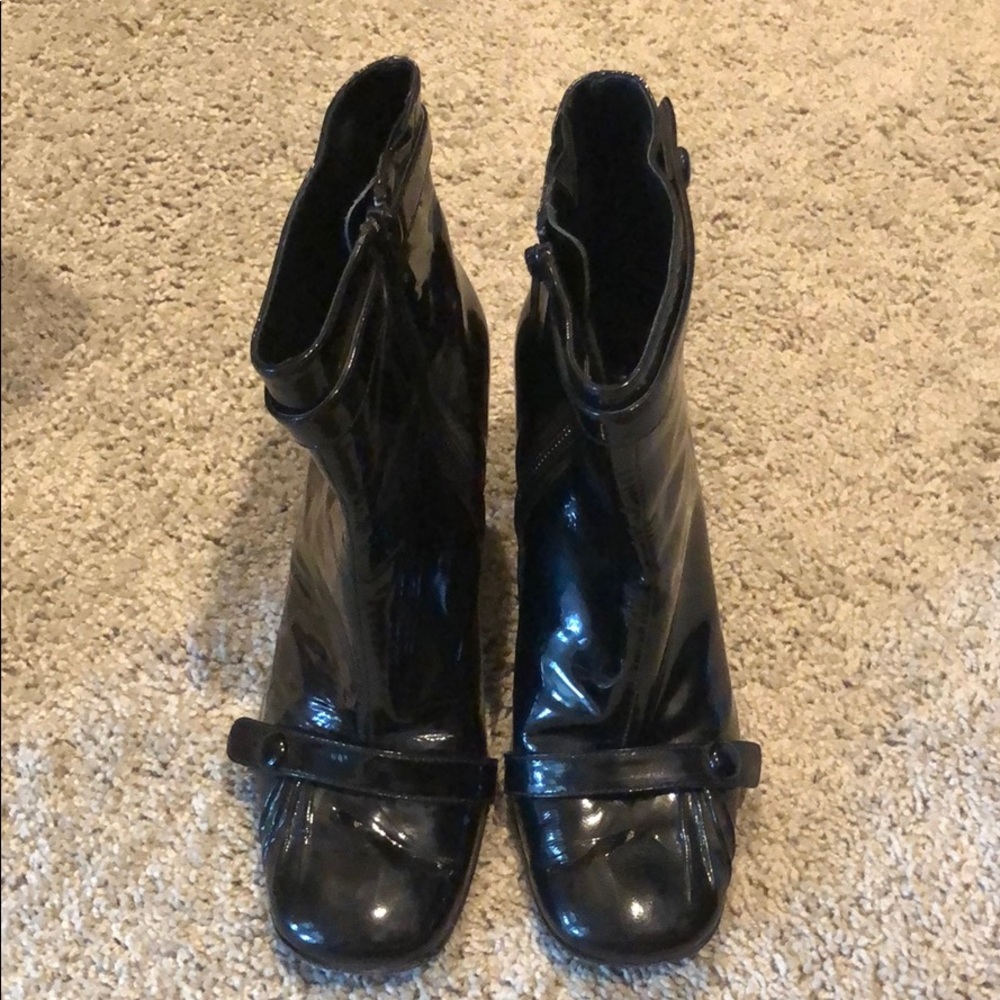 Black patent dress boots with leather sole.